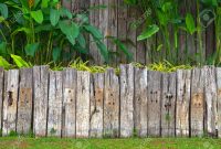 Old Wooden Fence In Garden With Plant Stock Photo Picture And inside size 1300 X 860