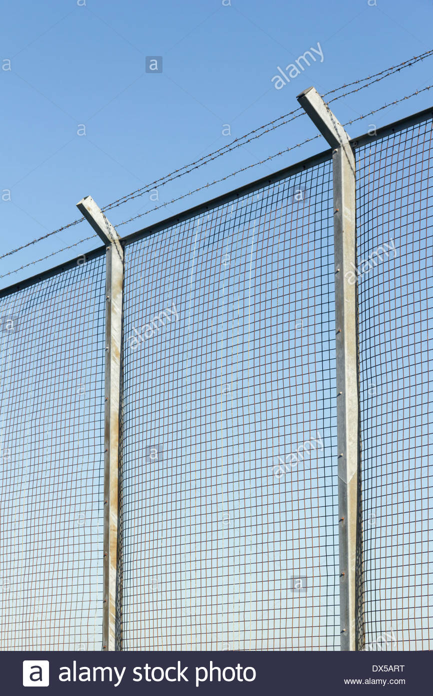 Tall Wire Mesh Security Fence On Concrete Posts Topped With Three inside measurements 866 X 1390