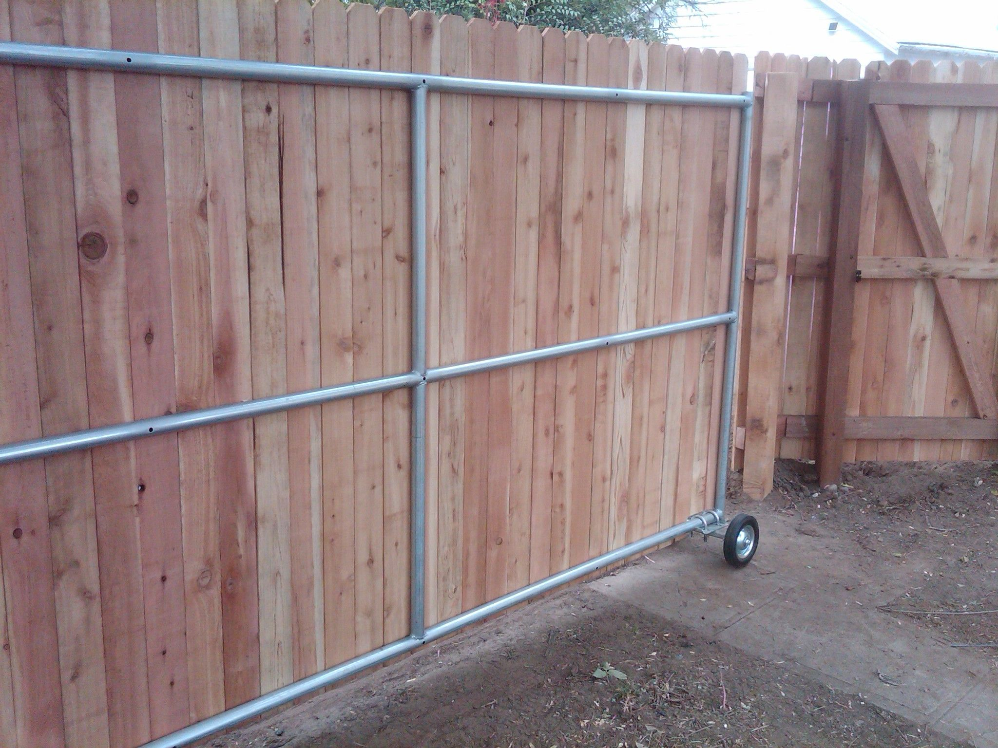 Wood Fence Ideas With A Gate Steel Framed Roll Gate With Wood regarding sizing 2048 X 1536