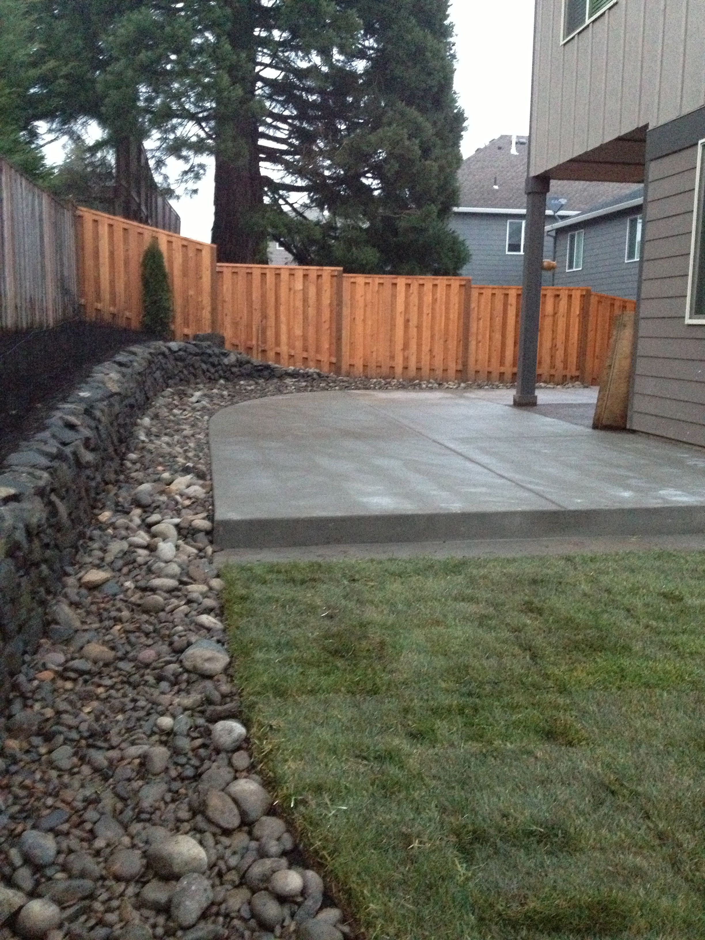 Concrete Patio River Rock Border With Drainage And Lawn with regard to size 2448 X 3264