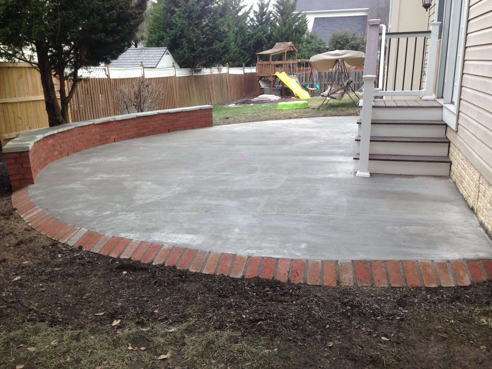 Concrete Patio With A Brick Seating Wall And Border In intended for dimensions 1600 X 1200