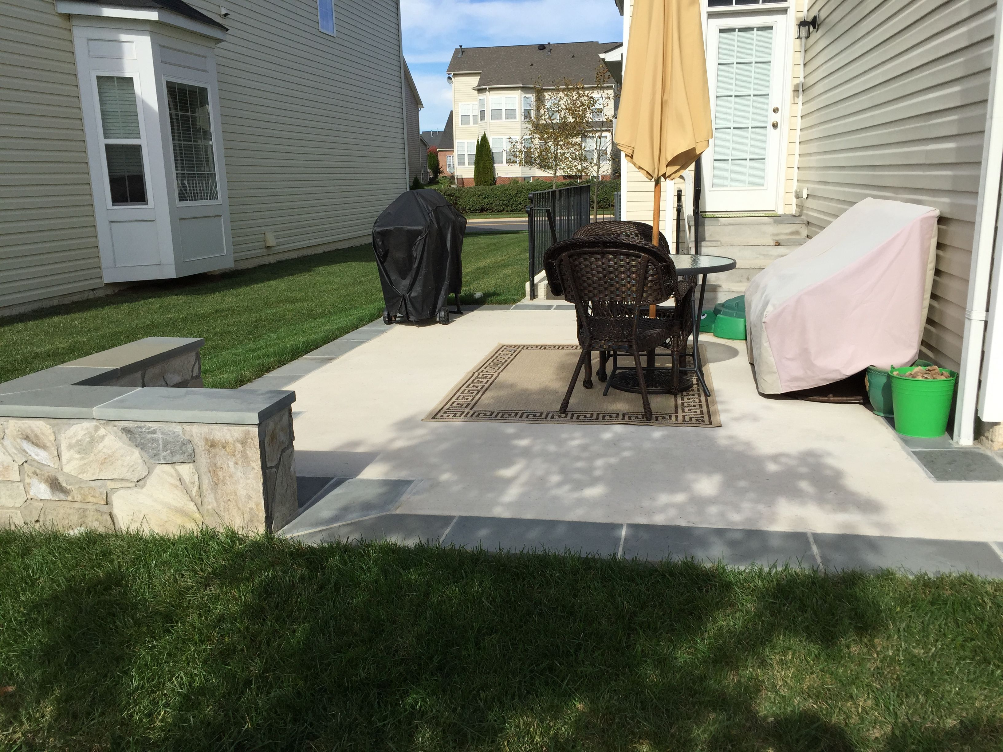 Concrete Patio With A Stone Seating Wall And Flagstone in proportions 3264 X 2448