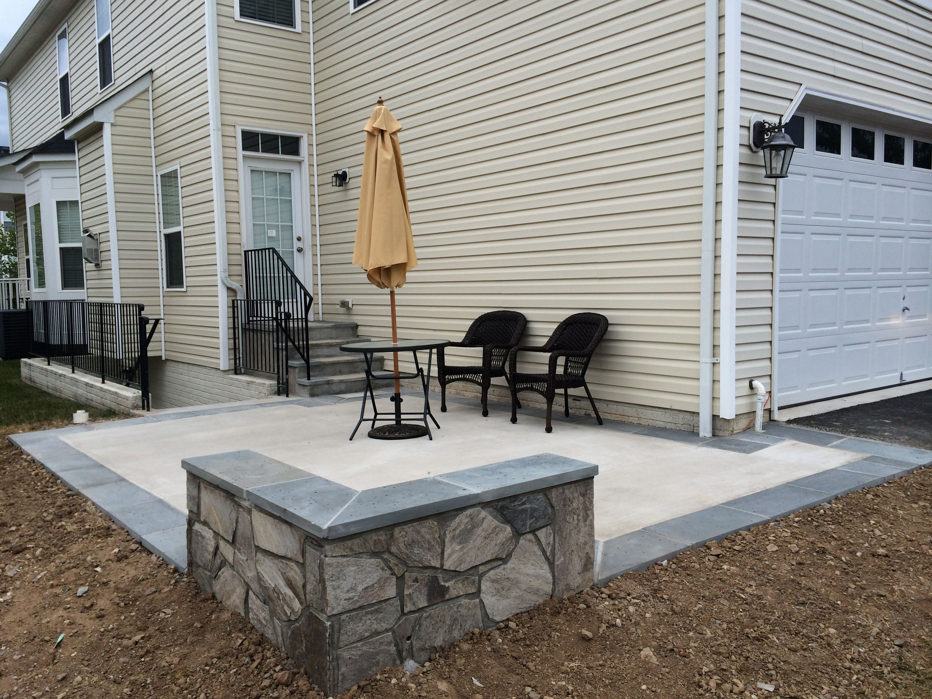 Concrete Patio With A Stone Seating Wall And Flagstone with regard to sizing 3264 X 2448