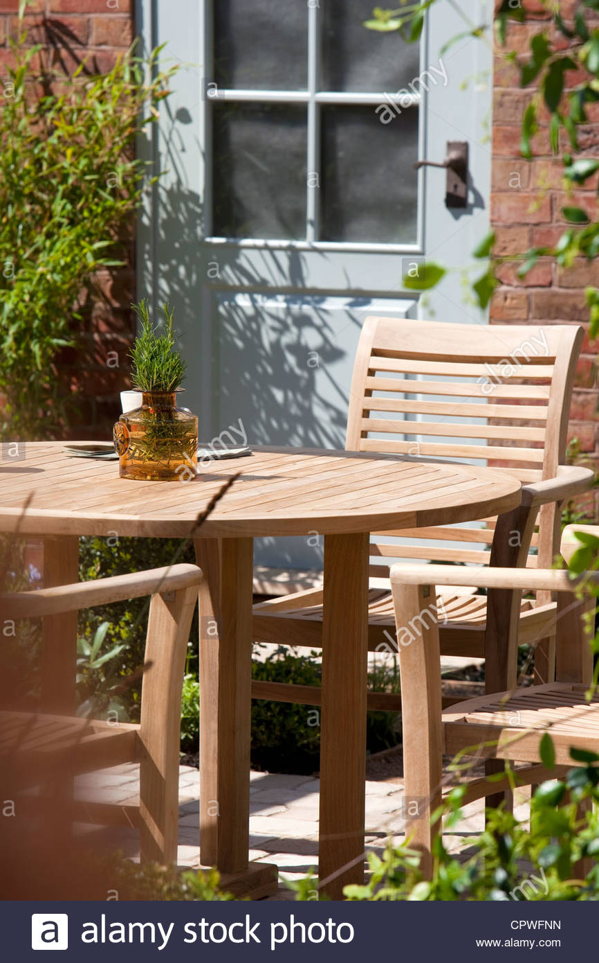 Garden Patio With Wooden Table And Chairs England Uk Stock intended for proportions 866 X 1390
