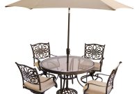 Hanover 5 Piece Outdoor Dining Set With Round Glass Table Swivel Chairs Umbrella And Base With Natural Oat Cushions pertaining to dimensions 1000 X 1000