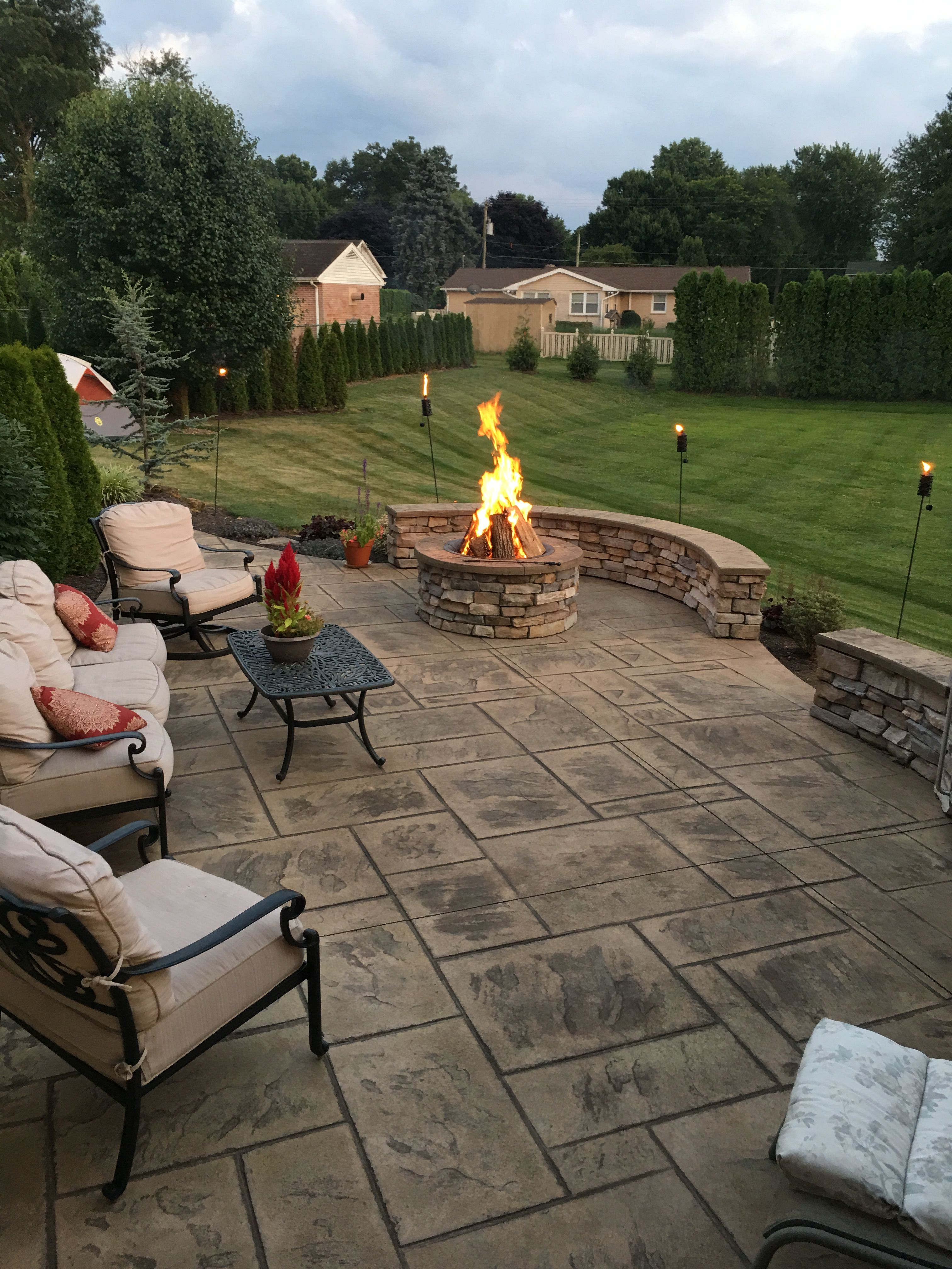 Stamped Concrete Patio With Stone Veneer Wall And Fire Pit with proportions 3024 X 4032