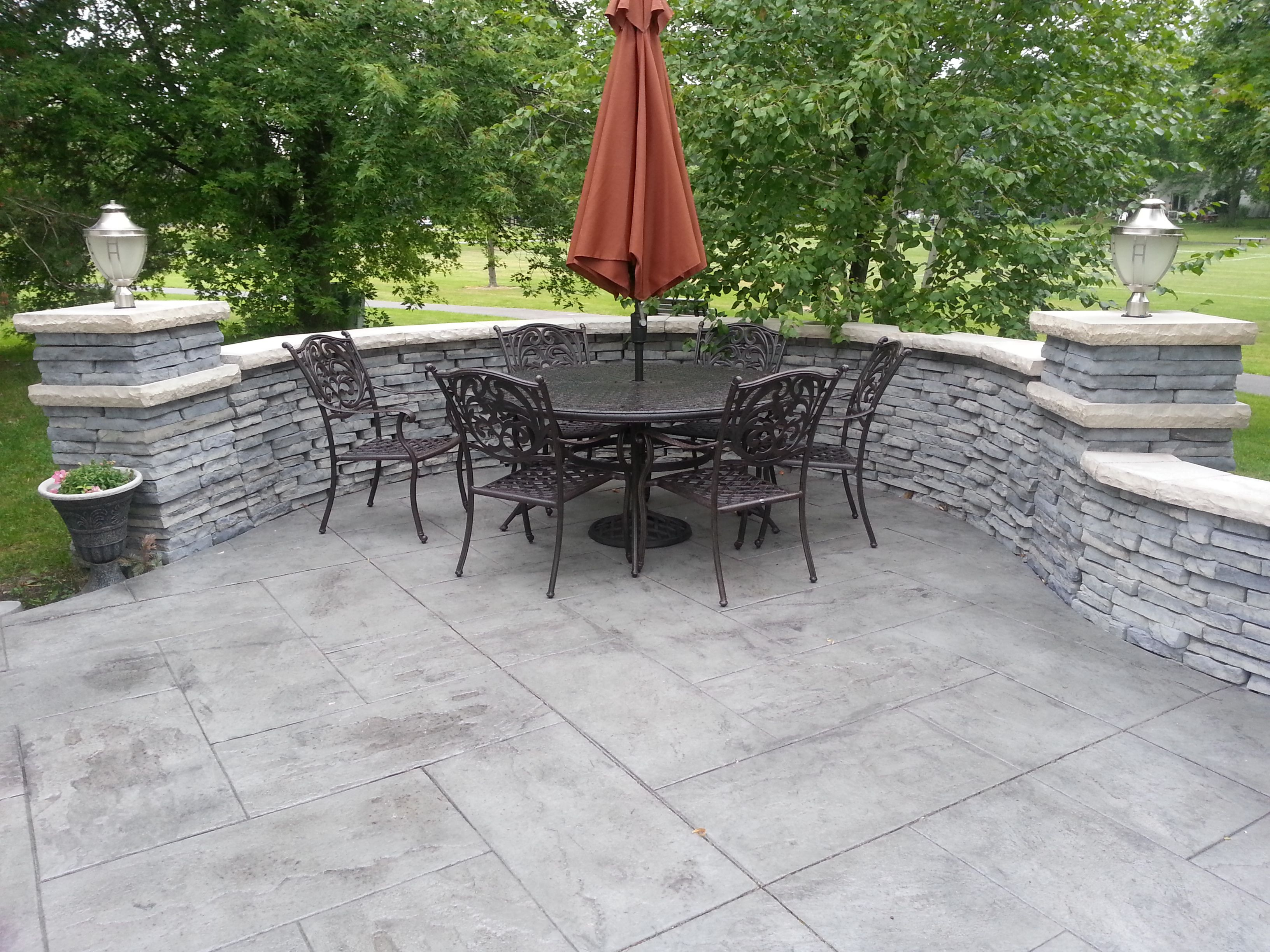 Stamped Concrete Patio With Unilock Stone Privacy Wall with dimensions 3264 X 2448