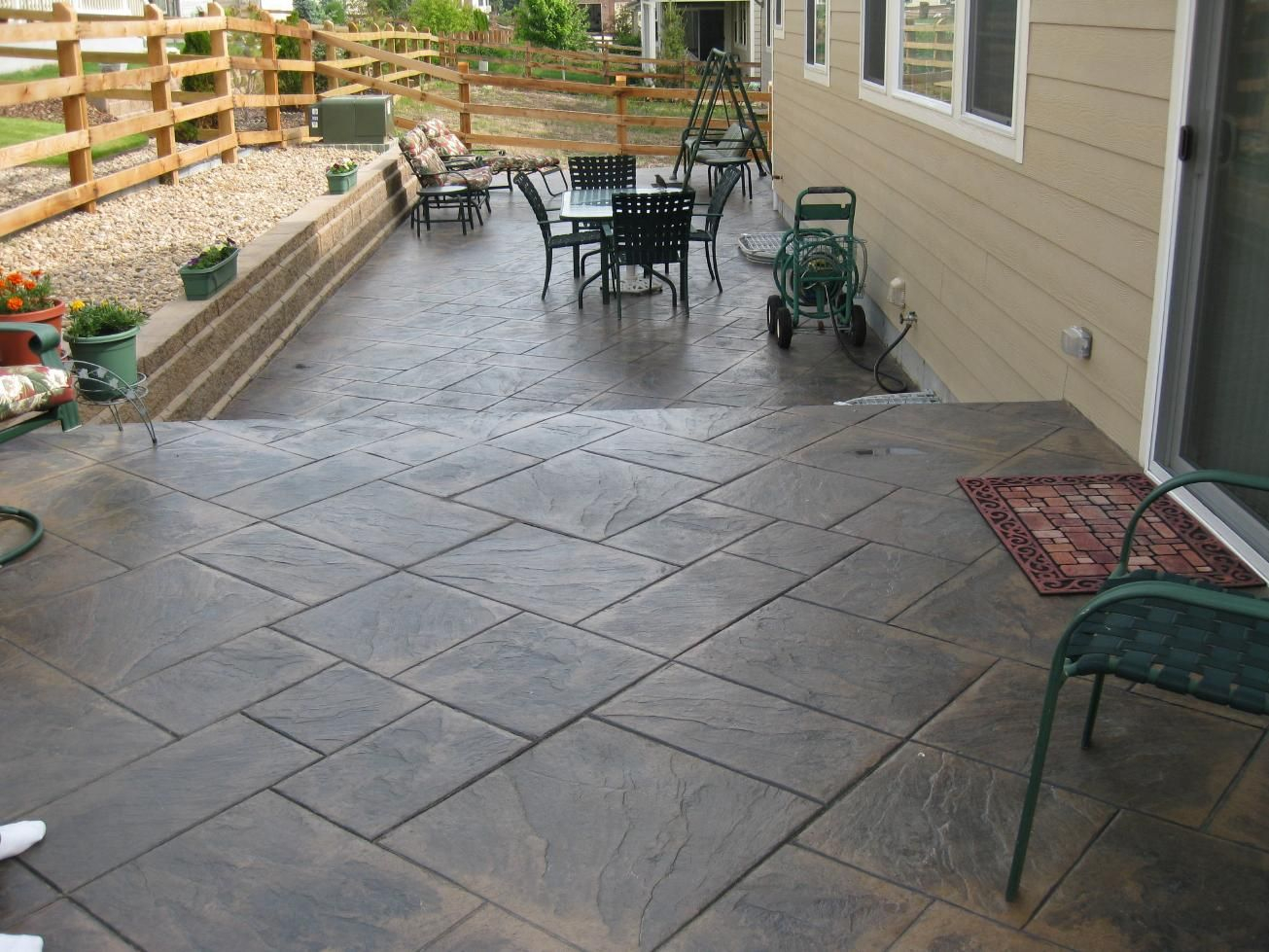 Stamped Concrete Under Deck Patio Decks Take A Walk Down for proportions 1305 X 979