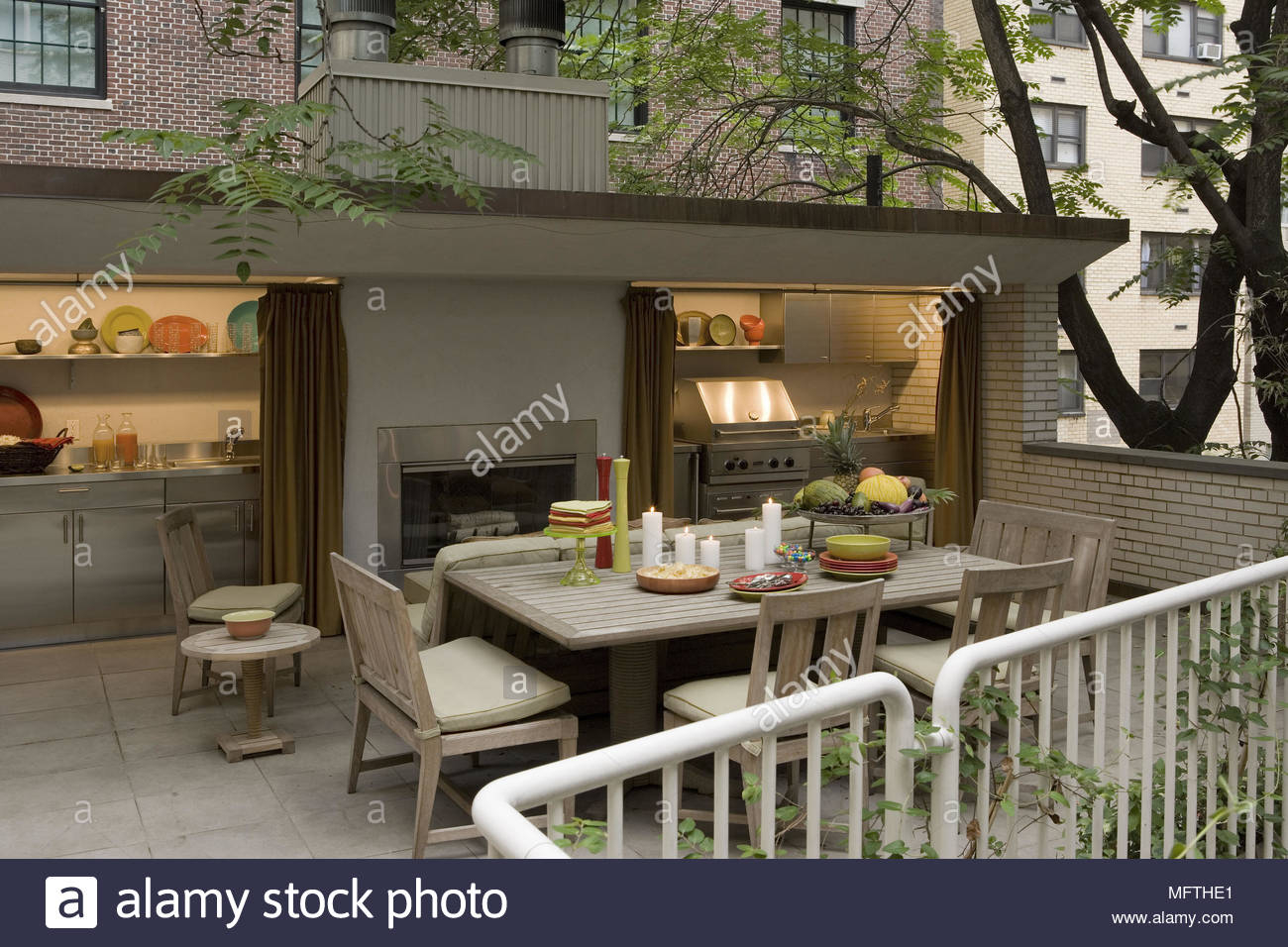 Table And Chairs On Patio With Outside Heating And Cooking pertaining to dimensions 1300 X 956