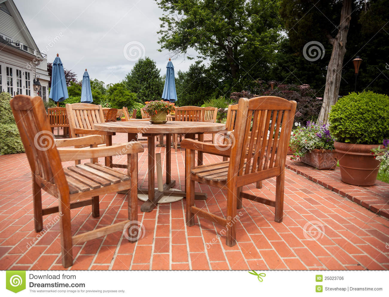 Teak Patio Tables And Chairs On Brick Deck Stock Photo with regard to sizing 1300 X 993