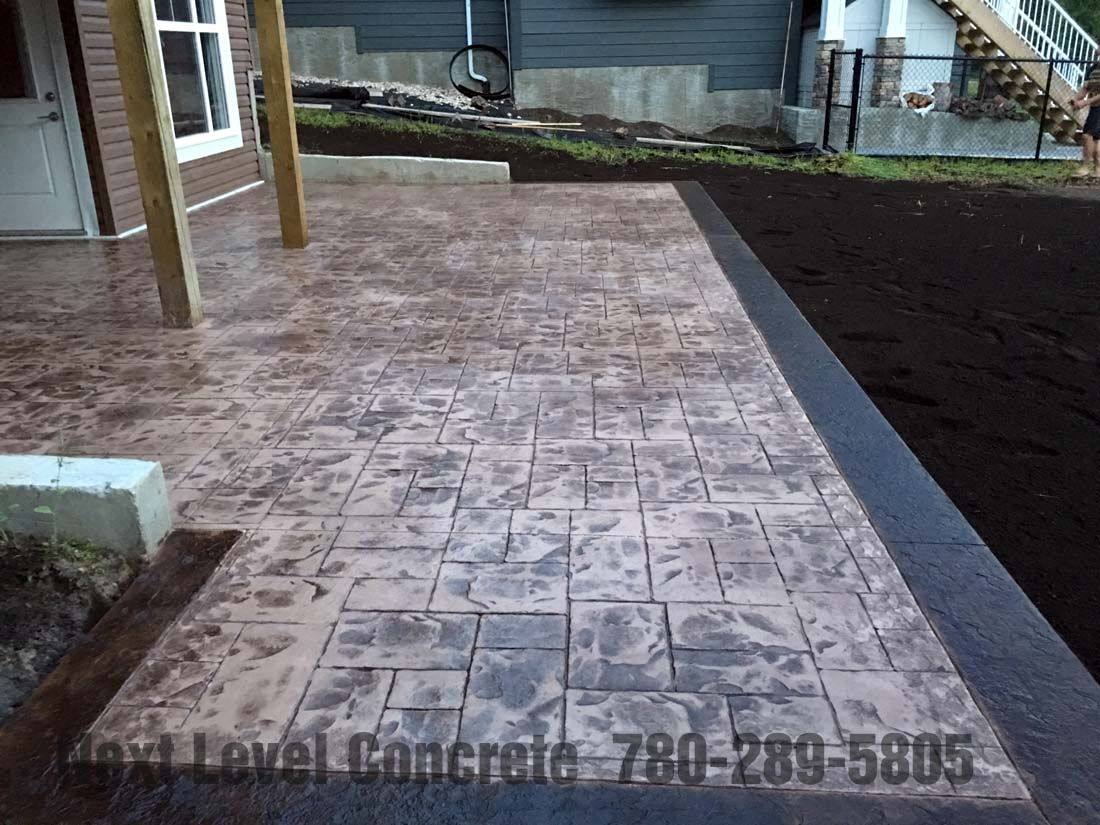 Walkout Basement Stamped Concrete Patio Next Level pertaining to proportions 1100 X 825